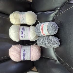 5 balls of yarn. Patons fingering, sidar, and Paton stretch socks.